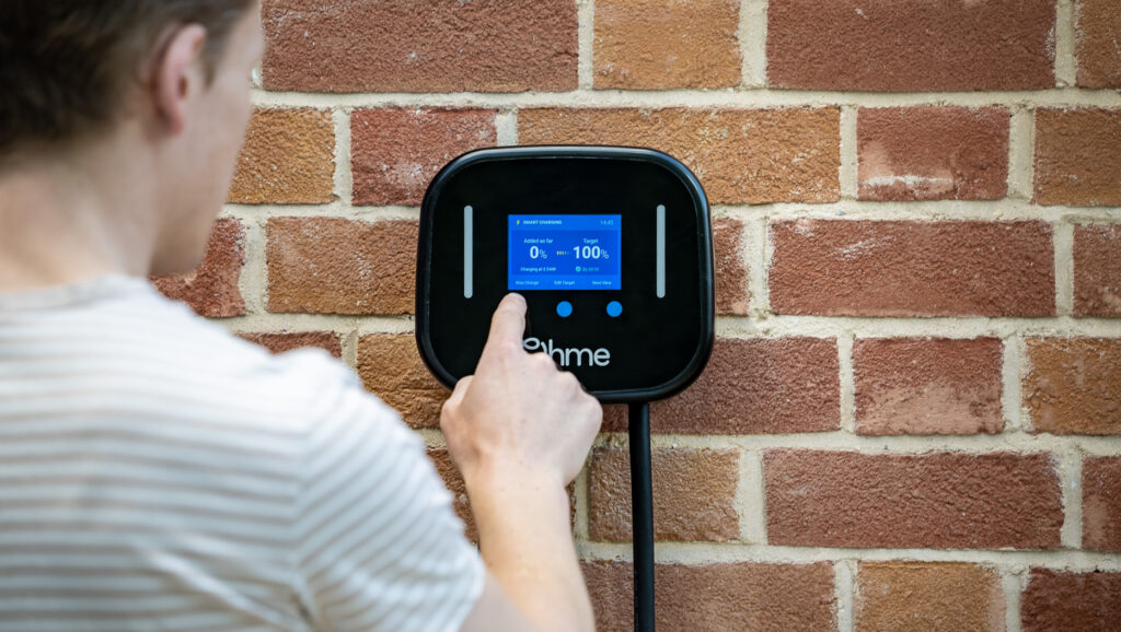 Person using the Ohme Home Pro ev charger