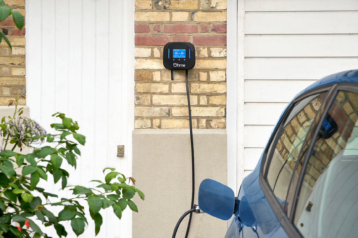 Ohme Home Pro EV charger with blue car