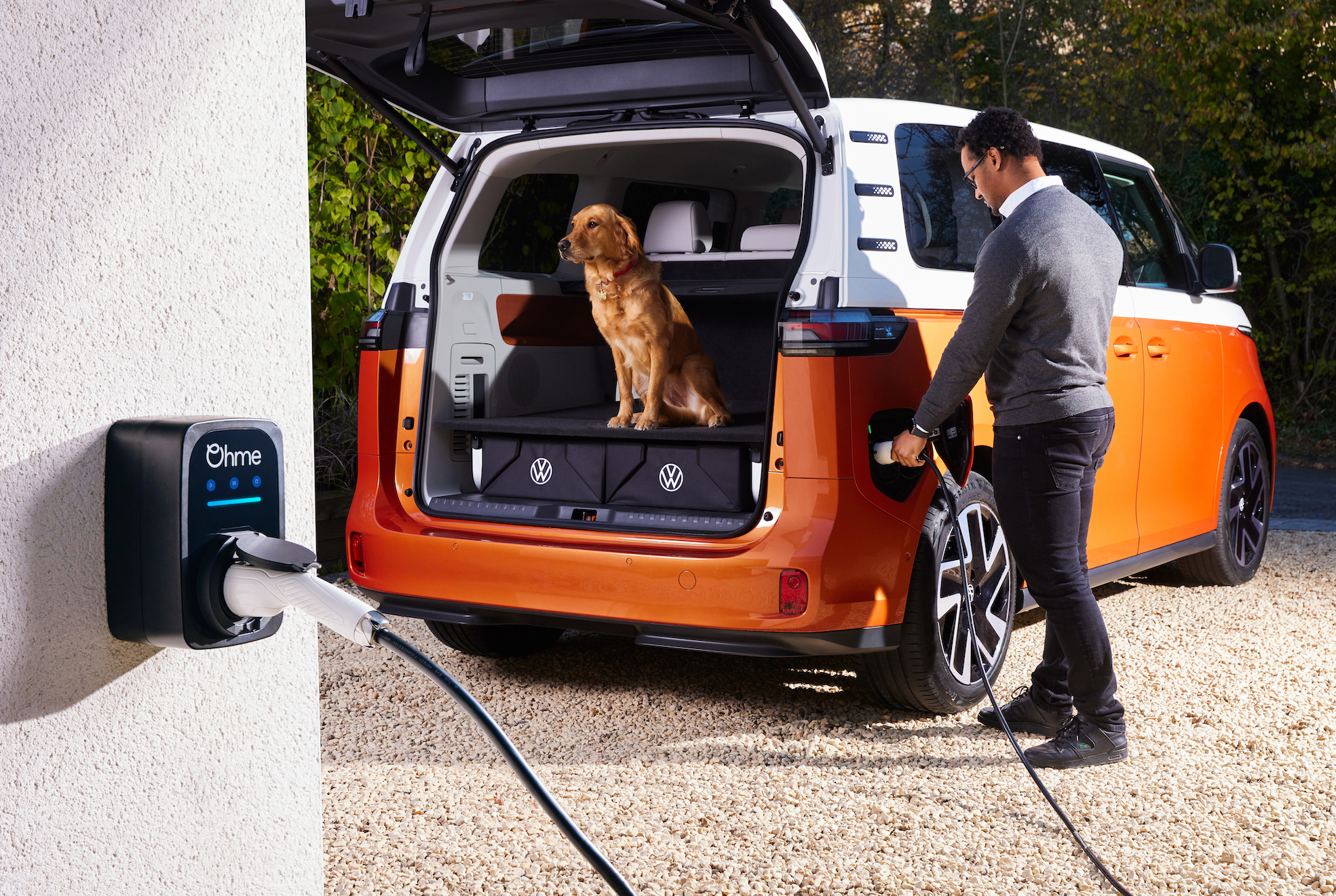 Man charging electric VW ID Buzz with Ohme ePod charger