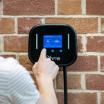 Person using the ohme home pro ev charger