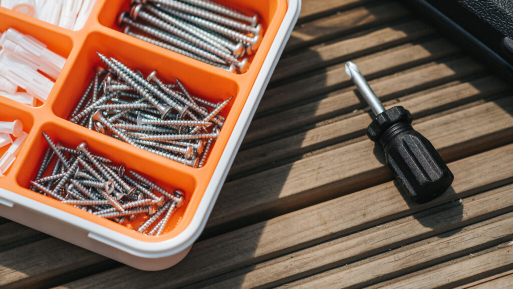 Toolbox with screws and a screwdrivers