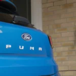 Blue Ford Puma plugged in to Ohme epodes home EV charger