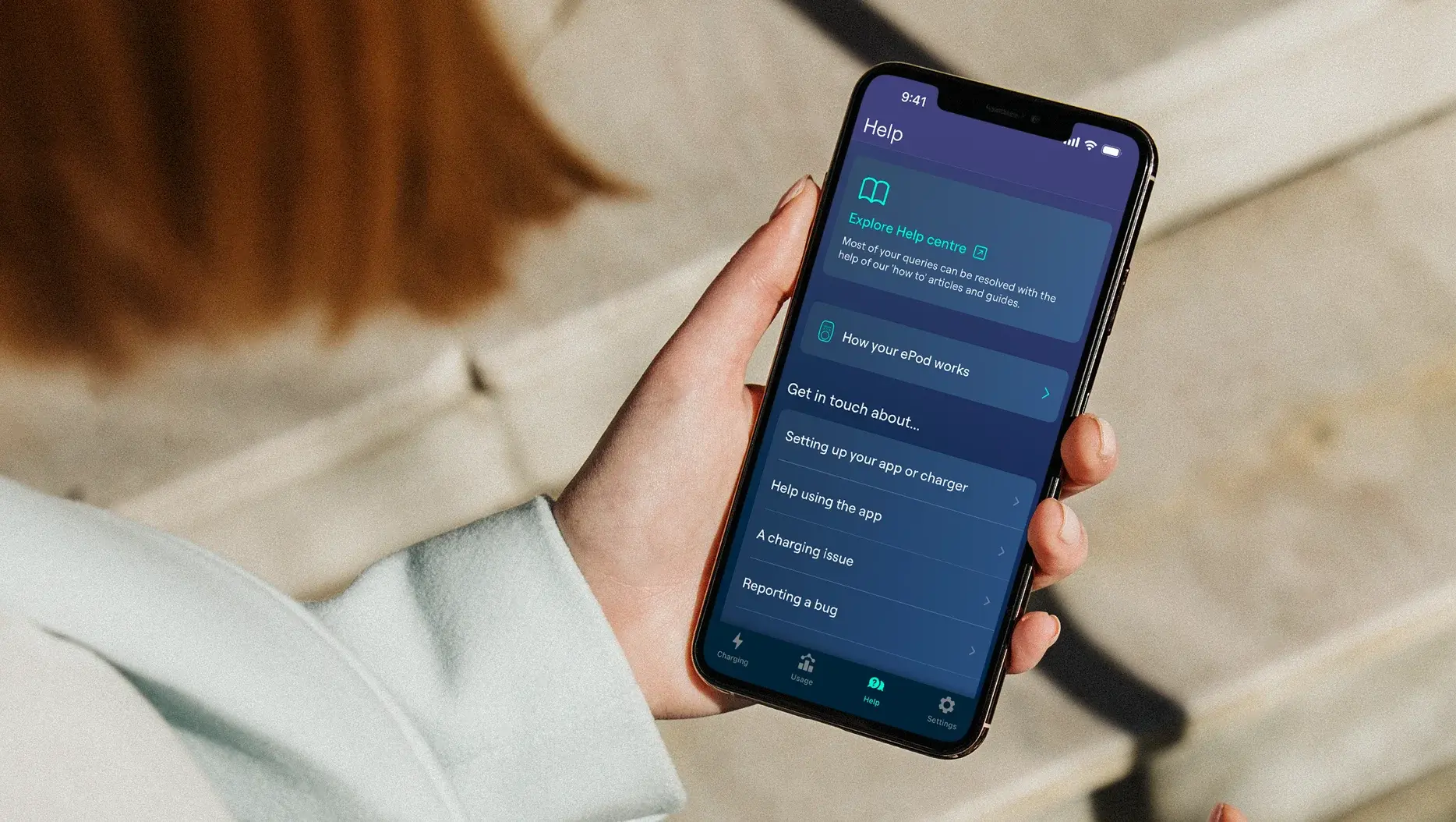 Hand holding phone showing the Help screen