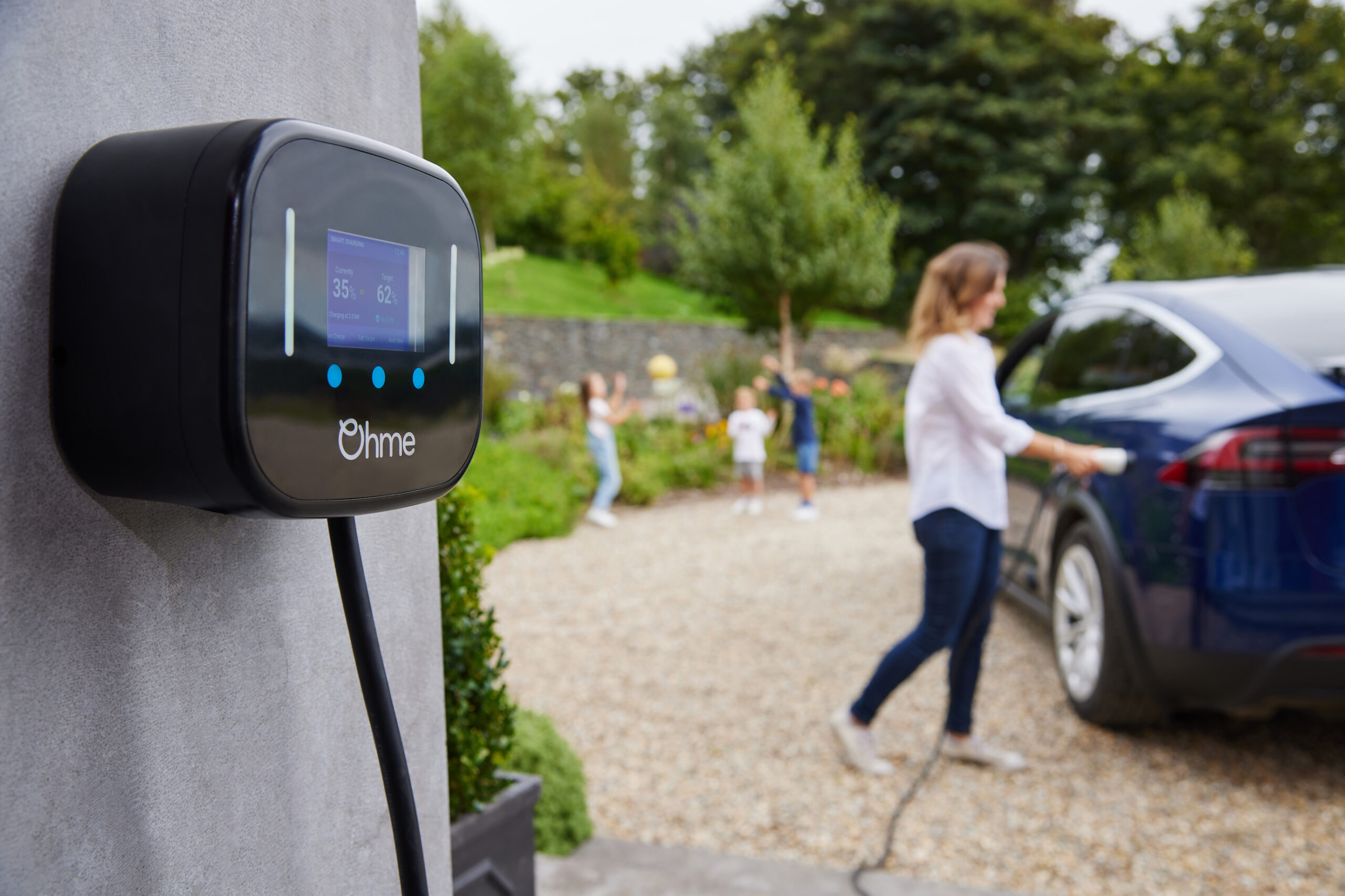 Ohme Home Pro EV Charger plugging in Tesla