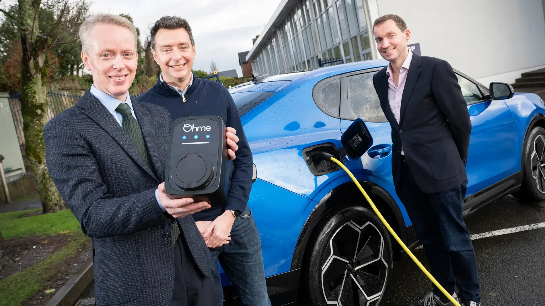 John Manning, Market Lead Ford of Ireland with Ohme CEO David Watson and Ohme Mobility Director Peter McDonald next to blue Ford Capri
